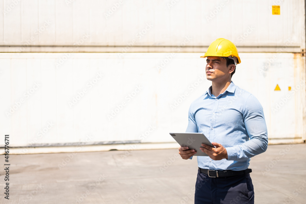Selective focus at face of freight supervisor and inspect the condition of all containers shipment by using tablet to record data. People and worker in freight deliver, import and export. Selective focus at face of freight supervisor and inspect the condition of all containers shipment by using tablet to record data. People and worker in freight deliver, import and export.