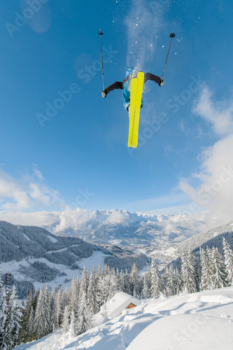 Male skieer does ski jumping in Werfenweng, Austria.