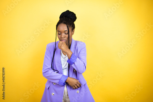Young african american business woman with her hand to her mouth because she's coughing © Irene