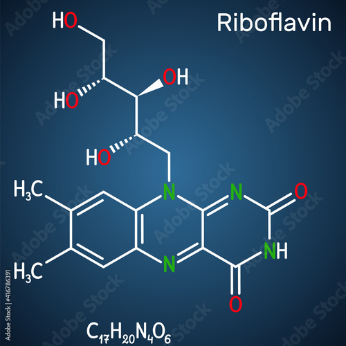 Riboflavin, vitamin B2 molecule.  It is water-soluble flavin, is found in food, used as a dietary supplement E101.  Structural chemical formula on the dark blue background