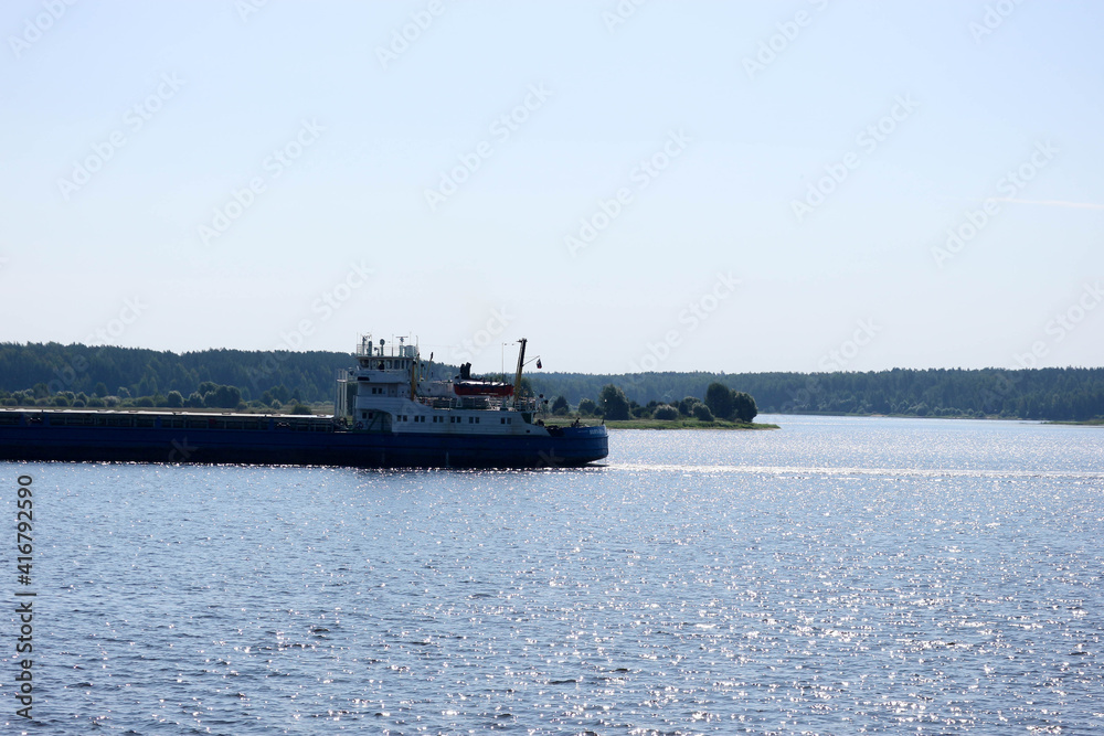 cargo ship on the river Volga in summer time