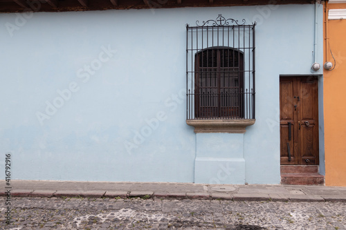 two color wall of clean colonial house, with wooden doors and classic balconies - for facade mockup (ID: 416792916)
