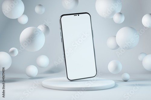 Smartphone with copy space on background with floating spheres