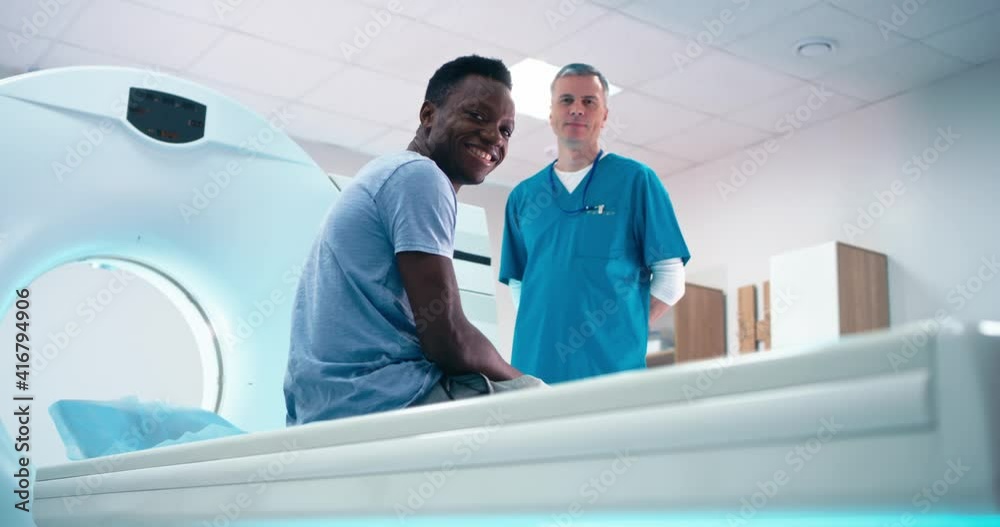 Diverse doctor and patient in CT lab in clinic