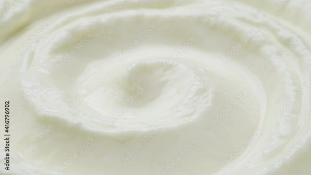 Sour cream macro, fresh greek yogurt swirl close up, whipped cream Sour cream macro, fresh greek yogurt swirl close up, whipped cream
