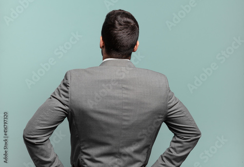 Schilderij op canvas young adult handsome businessman feeling confused or full or doubts and question