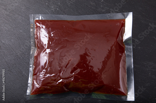 Red sauce in vacuum sealed plastic bag
