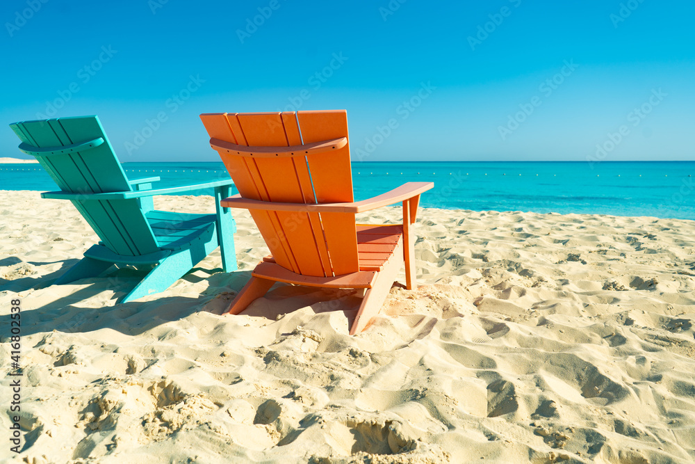 Dream paradise beach with 2 chairs at the turquoise Mediterranean sea at El Alamein near Alexandria, Egypt Dream paradise beach with 2 chairs at the turquoise Mediterranean sea at El Alamein near Alexandria, Egypt
