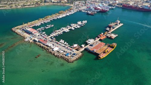 Aerial drone photo of small port next to shipyard and ship repair area of Perama next to island of Salamina, Attica, Greece © aerial-drone