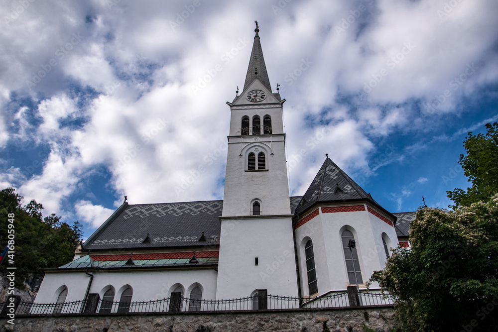 Church with a grey patterned roof in Bled.