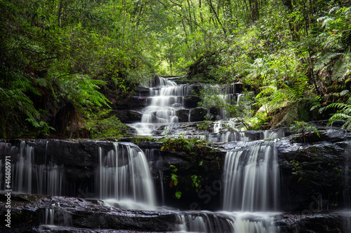 Waterfall flowing inside the rainforest area.