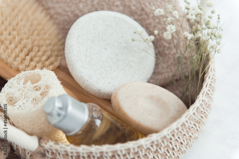 woven basket with natural body care products - sponge, towel, loofah, soap, body brush woven basket with natural body care products - sponge, towel, loofah, soap, body brush