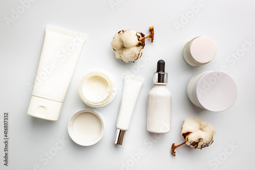 Flat lay composition with skin care products on white background
