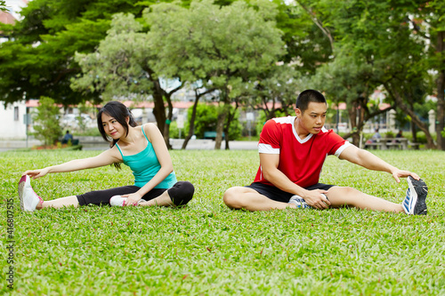 Happy couple training in the park - Fitness activety photo