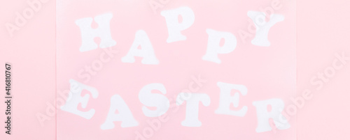 Happy Easter Greeting Card with the inscription on a pink paper background.