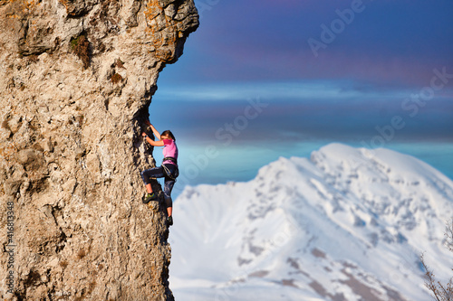 A young girl mountaineer during a climb