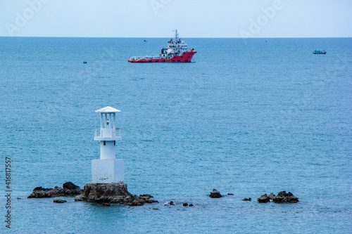 boats in the harbor ,lighthouse on the coast , Koh Samae San, Sattahip, Chonburi, Thailand