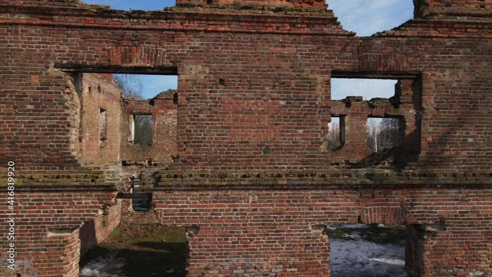 Ruins of an old mill in Loshitsa Park, Minsk, Belarus. Flying along the wall of a destroyed building. Ruins of an old mill in Loshitsa Park, Minsk, Belarus. Flying along the wall of a destroyed building.