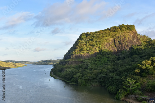 Green landscapes of Panama Canal, view from transiting ship.