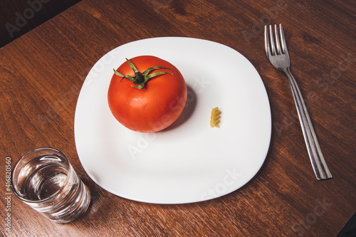vodka and tomato on a white plate