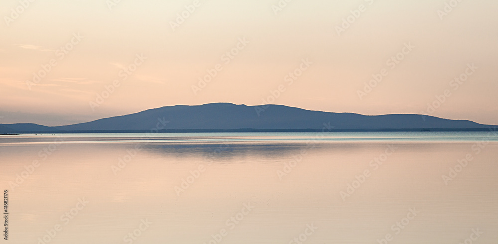 A fascinating party landscape for meditation. Calm on the lake, Kola Peninsula Tersky District lake kolvitsa. A fascinating party landscape for meditation. Calm on the lake, Kola Peninsula Tersky District lake kolvitsa.