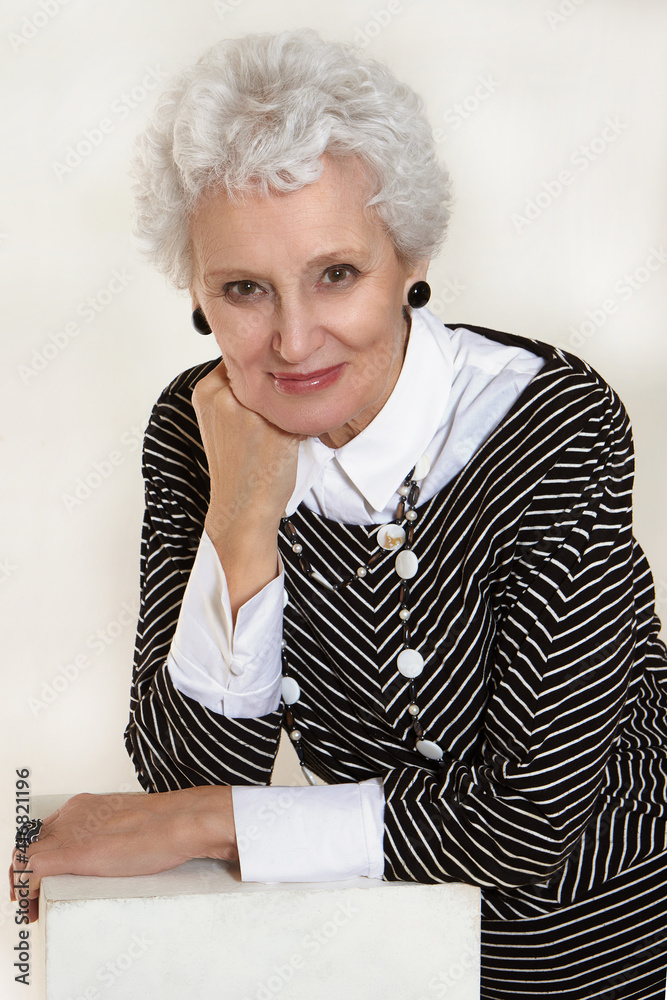 Close-up portrait of happy beautiful european lady in age with smile Close-up portrait of happy beautiful european lady in age with smile