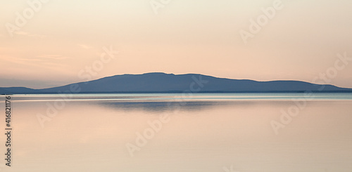 A fascinating party landscape for meditation. Calm on the lake, Kola Peninsula Tersky District lake kolvitsa.