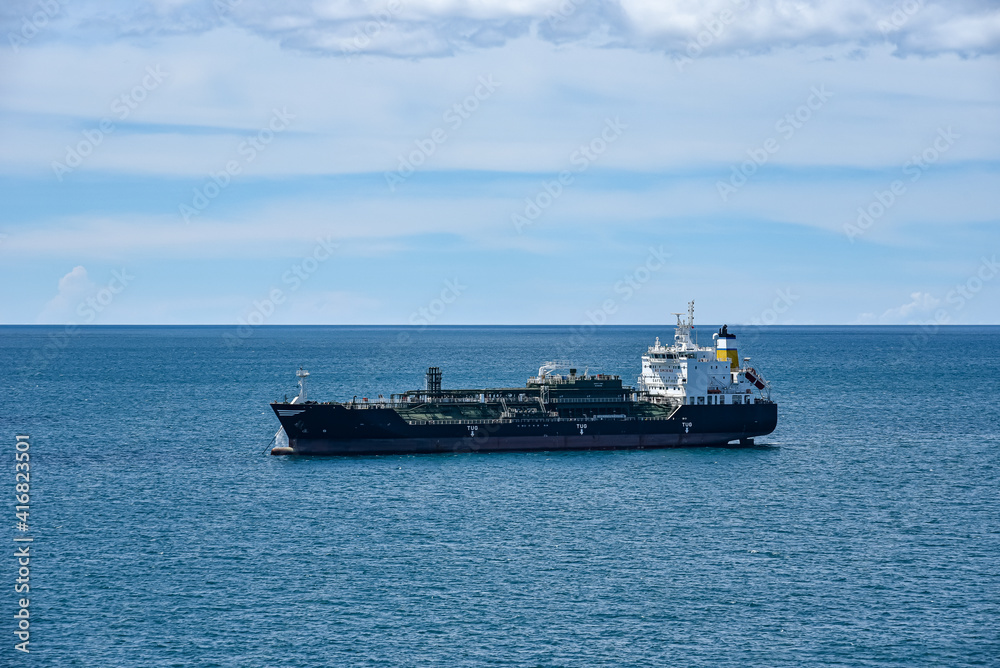 Tanker ship sailing through calm, blue ocean. Tanker ship sailing through calm, blue ocean.
