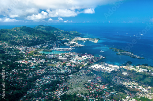 Aerial view of ciity Victoria with blue ocean, coastline and artificial islands. Mahe, Seychelles