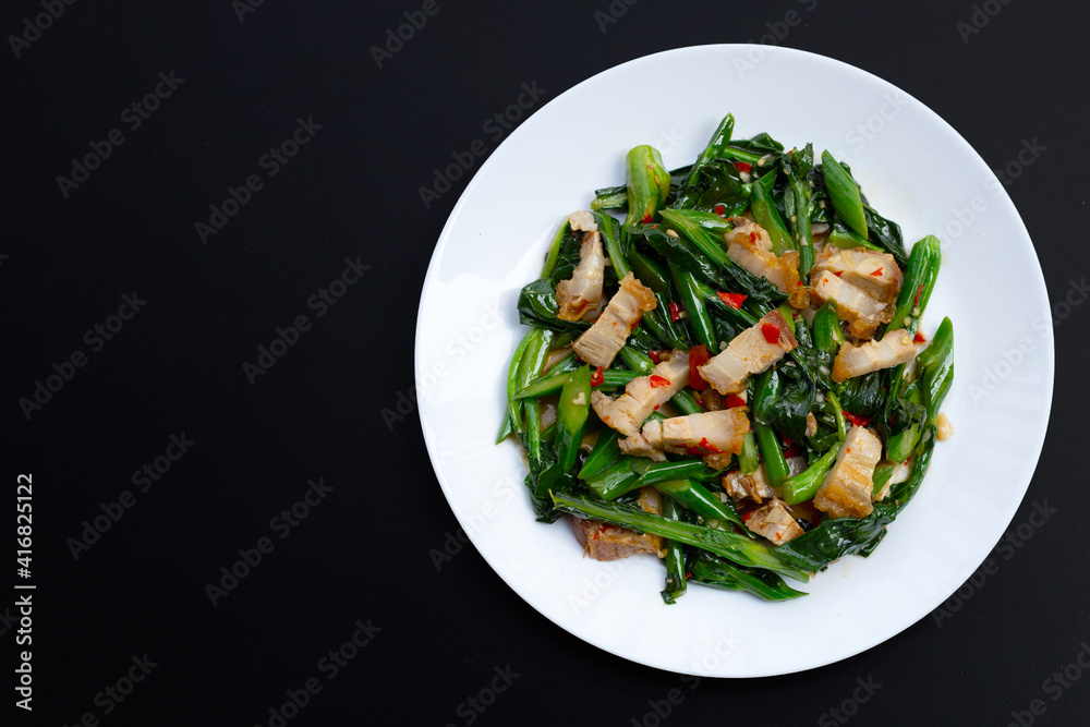 Stir fried chinese kale with crispy pork belly Stir fried chinese kale with crispy pork belly
