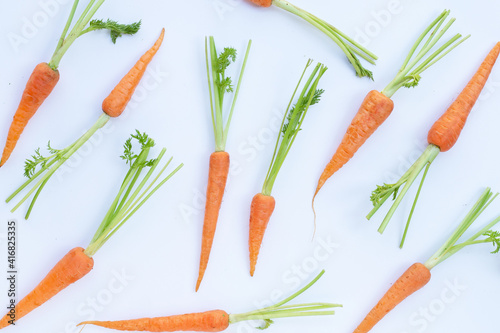 Fresh carrots on white background.