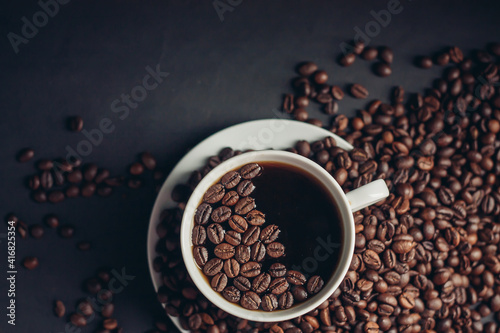 cup of coffee in female hands on a gray background morning breakfast aroma