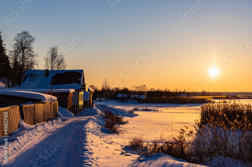 Sunset view of Chukhloma town and lake Chukhloma. Winter time. Kostroma region.