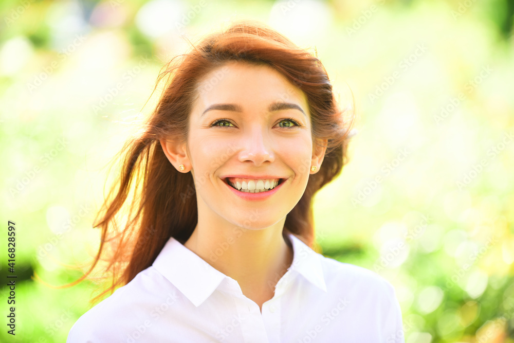 Happy cheerful ginger girl smiling looking at camera. Happy face. Happy cheerful ginger girl smiling looking at camera. Happy face.