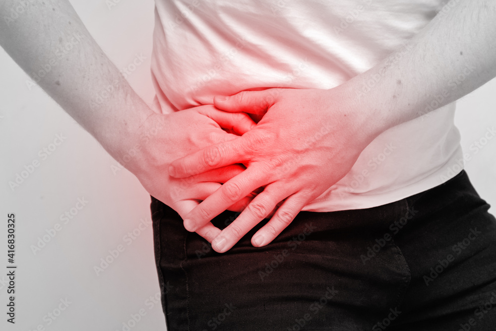 Person man experiencing pain from inflammation of appendicitis Person man experiencing pain from inflammation of appendicitis