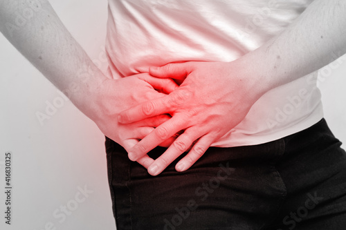 Person man experiencing pain from inflammation of appendicitis