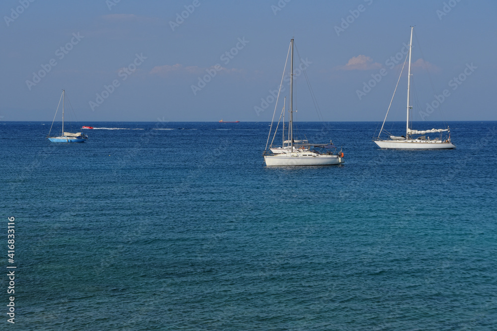 Sailboats in the Mediterranean Sea on a sunny and beautiful summer day