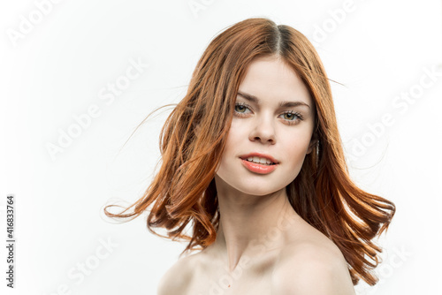 cheerful woman with bare shoulders loose hair smile clear skin