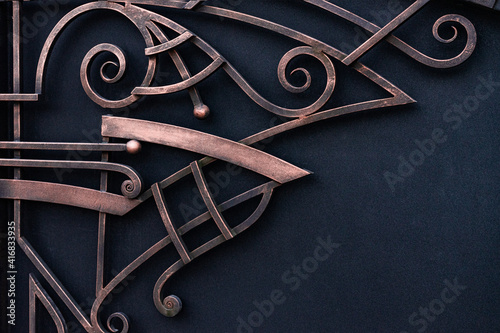 Beautiful decorative rectilinear forged elements of a metal gate