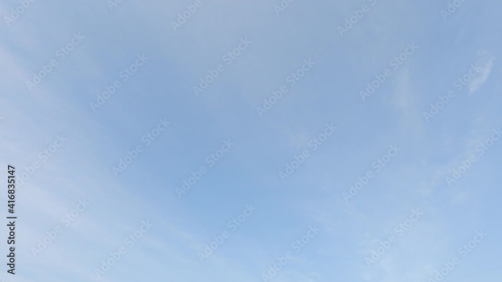 Sunny clear blue sky background with airy white cloud or cirrus n cirrostratus cloudscape on beautiful daylight horizon in tropical summer or spring sunlight n sunray, 4k cinemagraphs b-roll TimeLapse