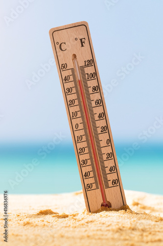 Close-up Of Thermometer On Sand photo