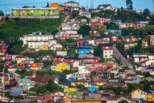 Chile, Puerto Montt. Painted houses and hillside neighborhood. photo