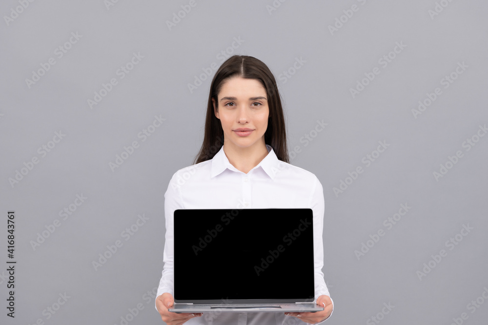 confident businesswoman presenting screen of laptop for presentation, copy space, advertisemet. confident businesswoman presenting screen of laptop for presentation, copy space, advertisemet.