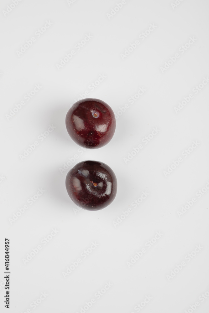 Two cherry plums isolated on white background Two cherry plums isolated on white background
