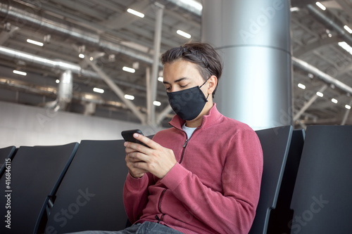Man traveller wearing mask in airport