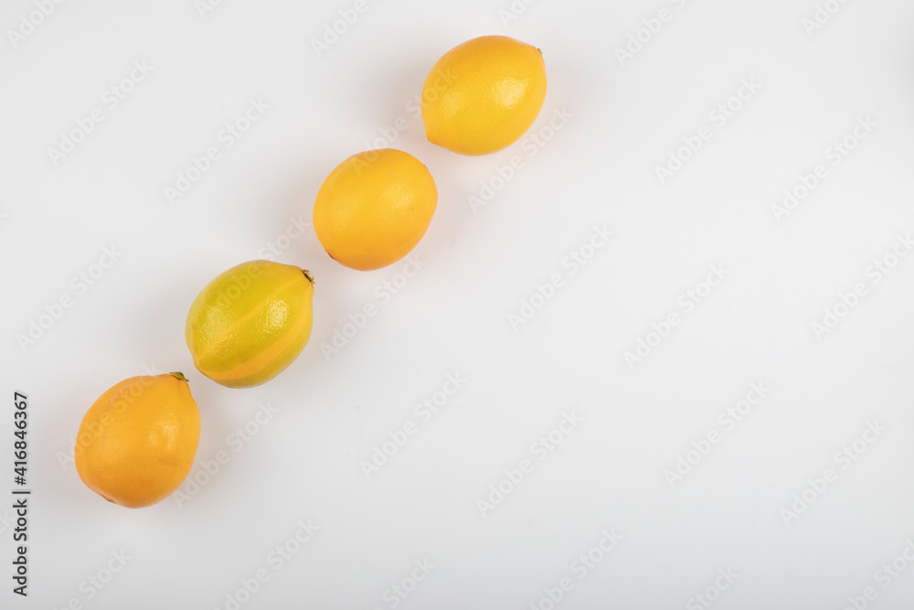 Fresh yellow lemons isolated on white background