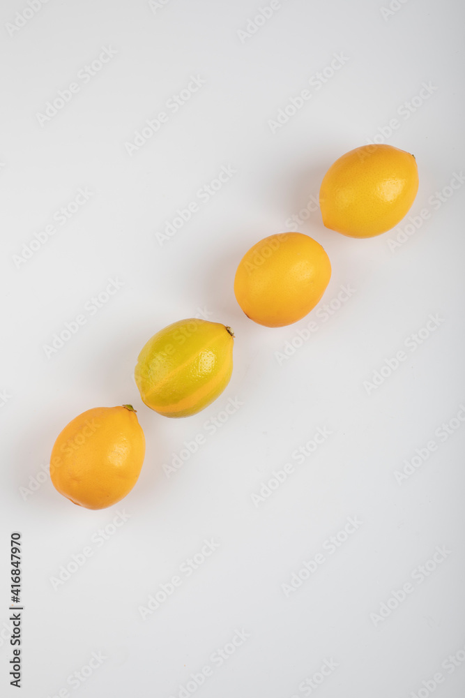 Fresh yellow lemons isolated on white background