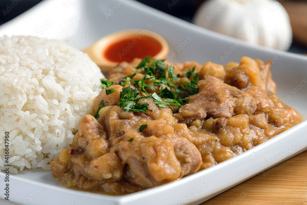 Teasty Peruvian food Carapulcra made with dry potatoes saute with chiken pork spices and red hot peppers sauce Teasty Peruvian food Carapulcra made with dry potatoes saute with chiken pork spices and red hot peppers sauce