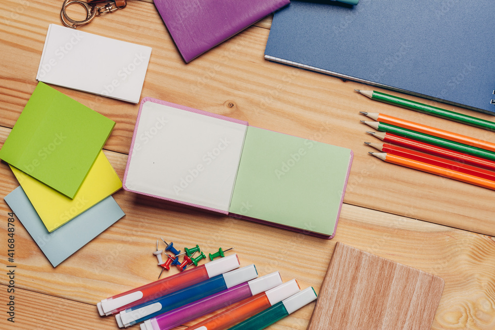 Obraz premium multicolored pencils work desk stationery notepad close up