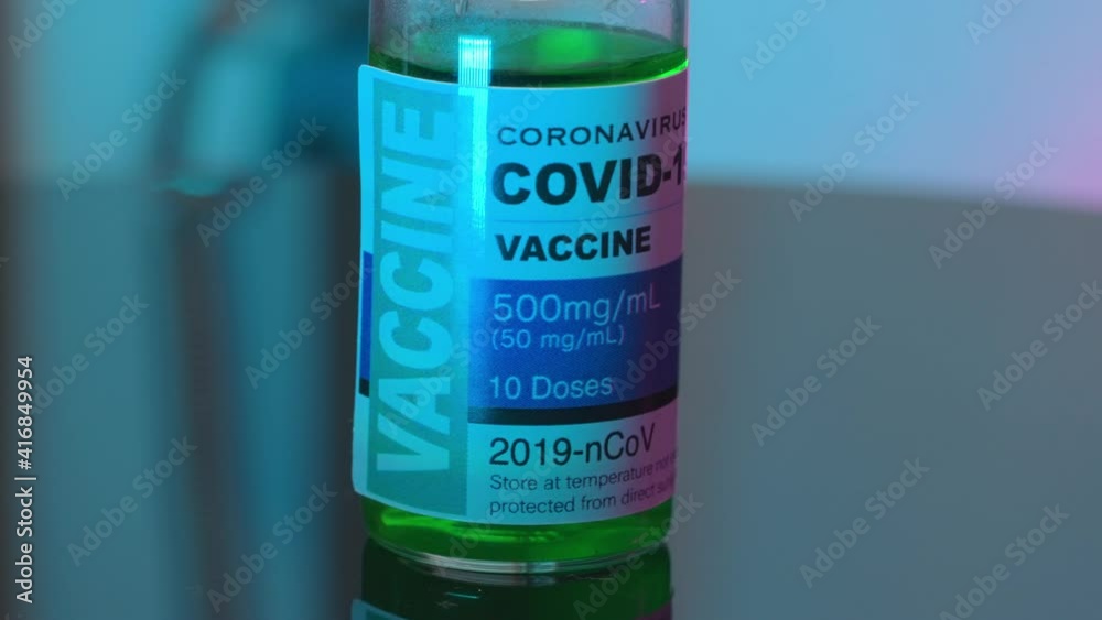 B-roll cinematic panning macro shot of covide-19 coronavirus vaccine concept in a bottle. B-roll cinematic panning macro shot of covide-19 coronavirus vaccine concept in a bottle.